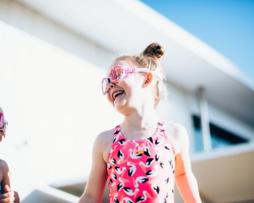 gold-coast-aquatic-centre-little-girls-smiling-by-in-pool