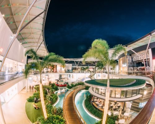 pacific-fair-shopping-at-night-in-atrium-people-in-restaurant-and-on-grass-and-chairs
